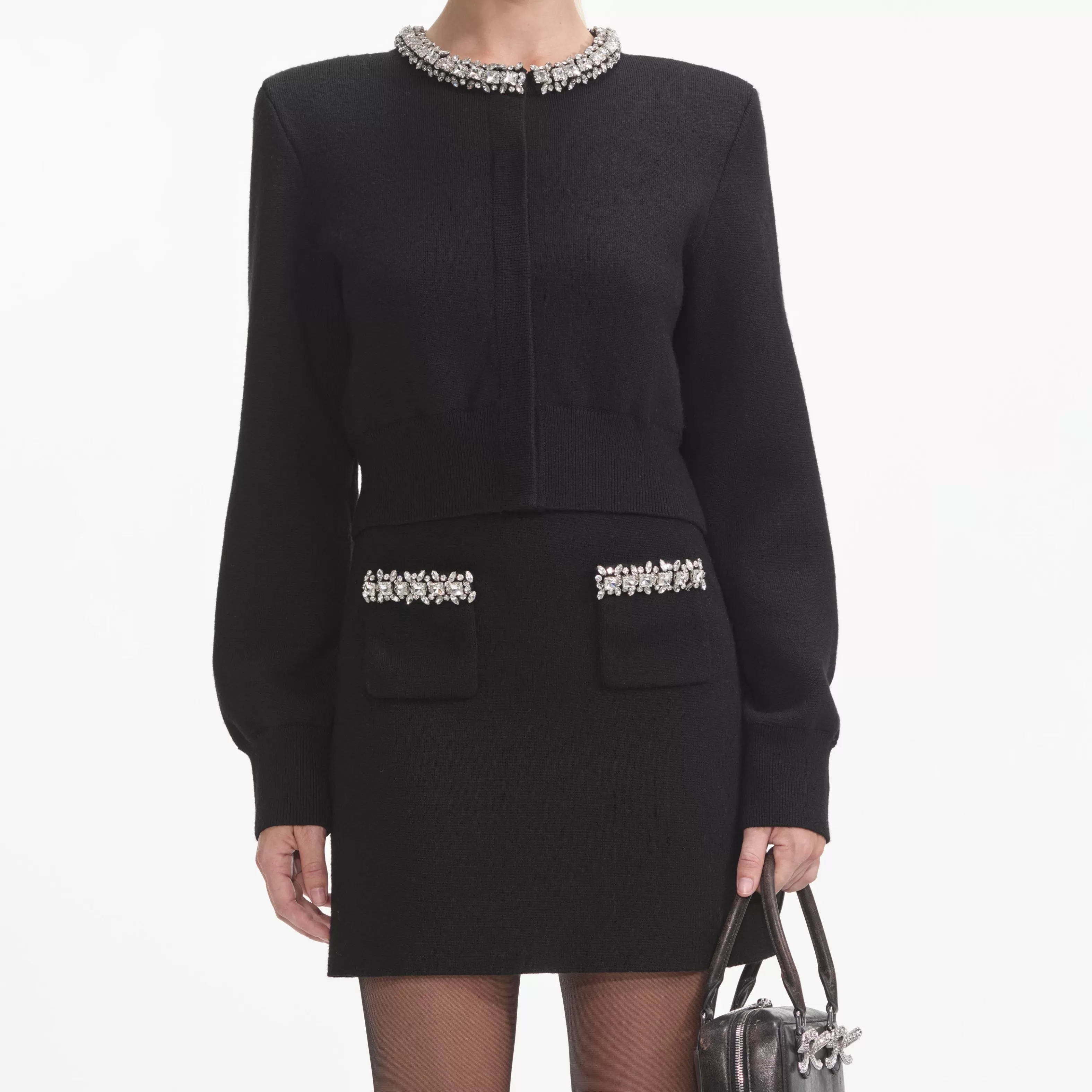 black_knit_embellished_mini_skirt_8873.webp Shop Knit Embellished Mini Skirt Knitwear | Co-ords