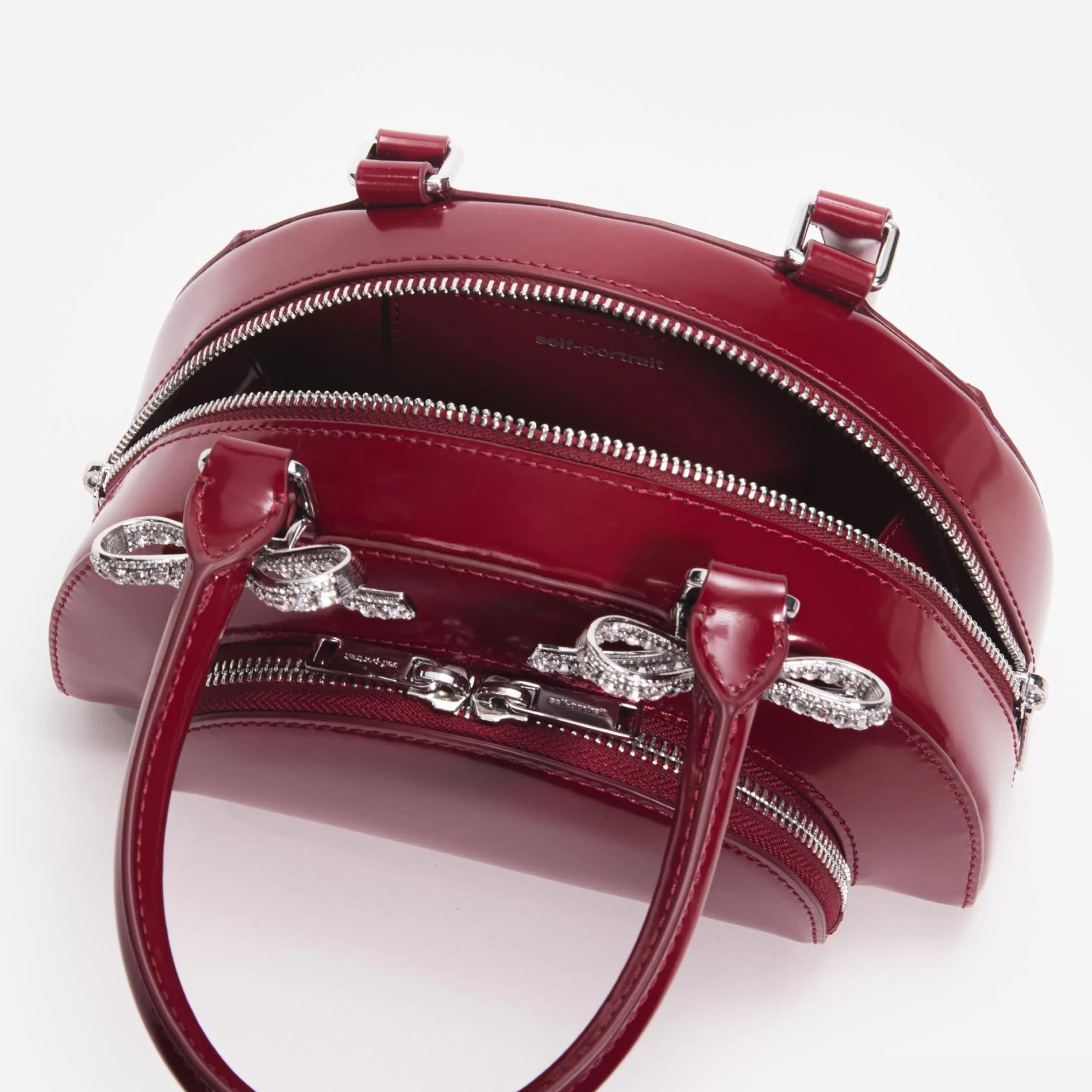 burgundy_leather_curved_mini_tote_bag_11161.webp New Leather Curved Mini Tote Bag Handbags