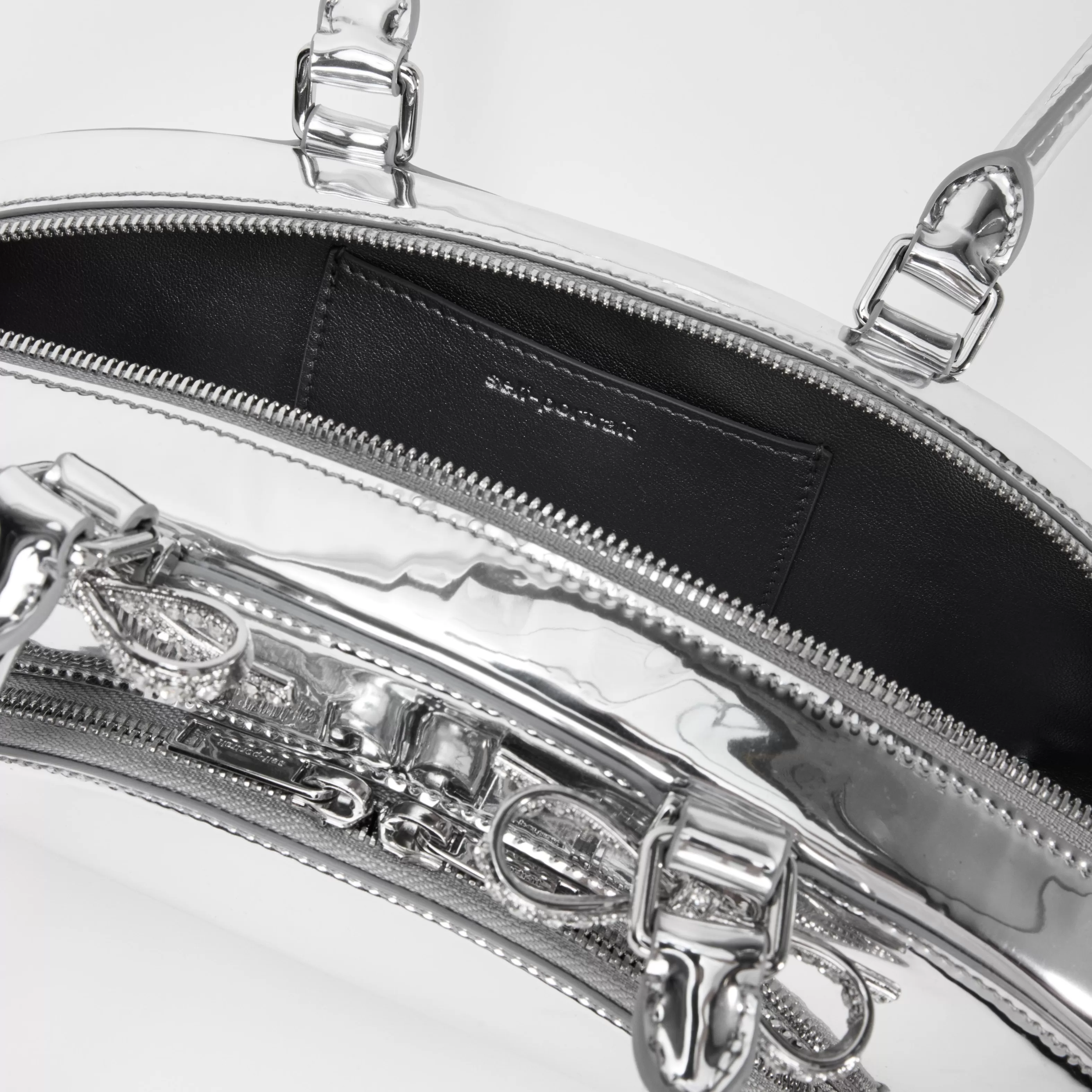 silver_metallic_curved_shoulder_bag_11102.webp Shop Metallic Curved Shoulder Bag Handbags